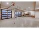 Spacious garage with modern doors, epoxy floor, and built in cabinets at 942 S Fulton St, Denver, CO 80247