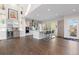 Bright, modern kitchen with a center island, stainless steel appliances, and plenty of cabinet space, perfect for cooking at 942 S Fulton St, Denver, CO 80247