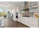 Contemporary kitchen boasts stainless steel appliances, stylish cabinetry, and opens to a comfortable living space, great for socializing at 942 S Fulton St, Denver, CO 80247