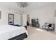 Comfortable main bedroom with neutral tones, a ceiling fan, and ample space, creating a tranquil atmosphere at 942 S Fulton St, Denver, CO 80247