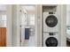 Bright, accessible bathroom includes stacked washer/dryer at 1454 Utica St, Denver, CO 80204