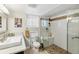 Bright bathroom with glass shower, modern fixtures, and natural stone accents at 1454 Utica St, Denver, CO 80204