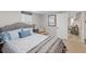 Cozy bedroom with ample natural light, carpeted floors, and calming colors for a peaceful atmosphere at 1454 Utica St, Denver, CO 80204