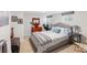 Serene bedroom featuring two windows, a queen bed, a dresser, and tasteful decor for a peaceful retreat at 1454 Utica St, Denver, CO 80204