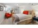 Cozy bedroom features plush carpet, natural light, and charming decor for a relaxing atmosphere at 1454 Utica St, Denver, CO 80204