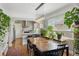 Open dining area with stylish lighting, hardwood floors, and abundant natural light at 1454 Utica St, Denver, CO 80204