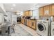 Well-equipped kitchen with modern appliances and functional laundry area at 1454 Utica St, Denver, CO 80204