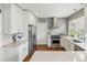 Bright, updated kitchen with white cabinetry, stainless steel appliances, and a functional layout at 1454 Utica St, Denver, CO 80204