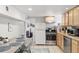 Bright kitchen with updated appliances and cozy breakfast table with chairs at 1454 Utica St, Denver, CO 80204