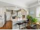 Modern kitchen with stainless steel appliances and an open layout with a breakfast bar at 1454 Utica St, Denver, CO 80204