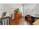 Office with hardwood floors, a desk, and a bright window at 1454 Utica St, Denver, CO 80204