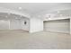 Large open basement area with neutral carpeting, recessed lighting, and ample space for various activities at 297 N Coolidge Way, Aurora, CO 80018
