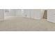 Expansive finished basement with new carpet and white walls, ready for customization at 297 N Coolidge Way, Aurora, CO 80018