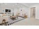 Finished basement features a cozy seating area with recessed lighting, a large TV, and ample storage space at 297 N Coolidge Way, Aurora, CO 80018