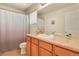 Bathroom featuring a neutral countertop vanity, large mirror and shower/tub combo at 297 N Coolidge Way, Aurora, CO 80018