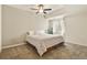 Cozy bedroom with neutral carpeting, ceiling fan, and a window providing natural light at 297 N Coolidge Way, Aurora, CO 80018
