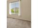 Bright bedroom with a neutral walls, carpet and a large window with a view at 297 N Coolidge Way, Aurora, CO 80018