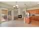 Open kitchen and living room area features an island with granite countertop and a fireplace at 297 N Coolidge Way, Aurora, CO 80018