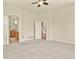 Spacious main bedroom provides an arched entrance to a bathroom and ample closet space at 297 N Coolidge Way, Aurora, CO 80018