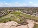 Community aerial view featuring a park with playground, trails, open grass, and some scattered trees at 5261 S Malta Way, Centennial, CO 80015