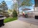 Back deck with built in seating and an outdoor grill at 5261 S Malta Way, Centennial, CO 80015
