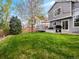 Backyard view showcasing the deck, grill, and expansive lawn at 5261 S Malta Way, Centennial, CO 80015
