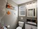 Charming powder room featuring gray walls, modern vanity and beach-themed decor at 5261 S Malta Way, Centennial, CO 80015