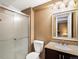 Bathroom with tiled shower, granite counter tops and modern lighting at 5261 S Malta Way, Centennial, CO 80015