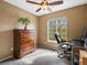 Bedroom featuring a large window with plenty of natural light and a ceiling fan at 5261 S Malta Way, Centennial, CO 80015