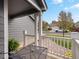 Inviting front porch with white railings, offering a serene outdoor space to enjoy the neighborhood views at 5261 S Malta Way, Centennial, CO 80015
