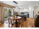 Eat-in kitchen featuring white cabinets, granite countertops, a center island and stainless appliances at 5261 S Malta Way, Centennial, CO 80015