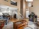 Open-concept living area with hardwood floors, a staircase, and seamless flow to the kitchen at 5261 S Malta Way, Centennial, CO 80015