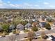 An aerial view of a well-maintained neighborhood with diverse homes and mature trees, offering a peaceful setting at 5261 S Malta Way, Centennial, CO 80015