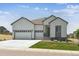 Charming home featuring a three-car garage, well-maintained lawn, and welcoming curb appeal at 13805 Emerald Lake St, Parker, CO 80138