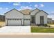 Charming home featuring a three-car garage, well-maintained lawn, and welcoming curb appeal at 13805 Emerald Lake St, Parker, CO 80138