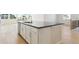 Modern kitchen island with dark countertop and white cabinets at 13805 Emerald Lake St, Parker, CO 80138