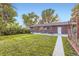 Spacious backyard featuring a concrete patio and a well-maintained lawn at 2982 S Vrain St, Denver, CO 80236