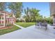 Spacious backyard with a concrete patio, outdoor seating, and a small shed at 2982 S Vrain St, Denver, CO 80236