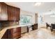 Bright kitchen with stylish countertops and a wine rack next to a large window at 2982 S Vrain St, Denver, CO 80236