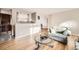 Cozy living room with hardwood floors, neutral paint, and lots of natural light at 2982 S Vrain St, Denver, CO 80236