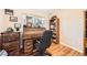 Dedicated home office features hardwood floors, a large window, and classic rolltop desk at 2982 S Vrain St, Denver, CO 80236
