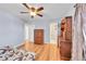 Bedroom featuring wood-look flooring and closet with sliding doors at 1205 S Argonne Cir, Aurora, CO 80017