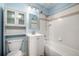 Bathroom with a shower-tub combo, vanity, and cabinet at 8023 Wolff St # C, Westminster, CO 80031