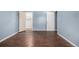 Bedroom with closet provides ample storage with a neutral color scheme and wood floor at 8023 Wolff St # C, Westminster, CO 80031