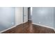 Bedroom with wood floors and closet at 8023 Wolff St # C, Westminster, CO 80031