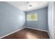 Cozy bedroom features hardwood floors and natural light from a window at 8023 Wolff St # C, Westminster, CO 80031