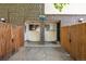 Inviting entrance with a fenced-in patio, brick accents, and updated doors at 8023 Wolff St # C, Westminster, CO 80031