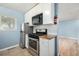 Modern kitchen featuring stainless steel appliances, tile backsplash, and sleek countertops at 8023 Wolff St # C, Westminster, CO 80031