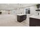 Finished basement featuring large open space, mini bar, and pendant lighting at 863 Edenborn Pl, Castle Rock, CO 80104