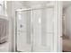 Modern bathroom featuring a glass-enclosed shower with stylish white and gray tile accents at 863 Edenborn Pl, Castle Rock, CO 80104